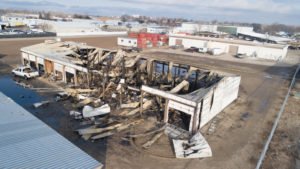 A storage building destroyed by a fire.