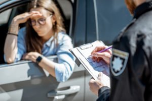 A woman is nervous about taking a breath test.