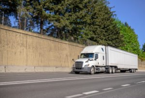 A big rig traveling on a highway.