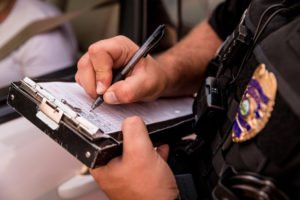 cop writing a ticket