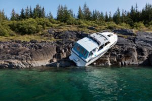 recreational boat washed-up-on-the-shore