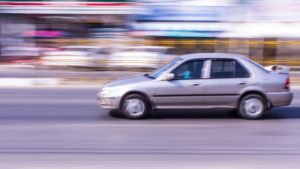 car speeding in the road