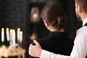 grieving couple at a funeral