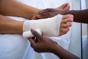 patient getting foot bandaged