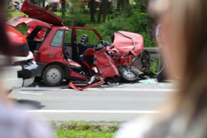 torn-up red car after an accident