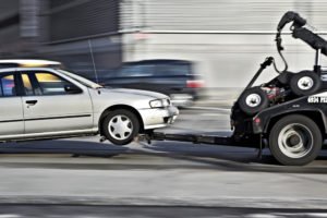 tow-truck whipping through traffic