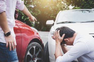 man yelling at the other driver after an accident