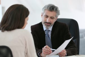 car accident lawyer meets with a client