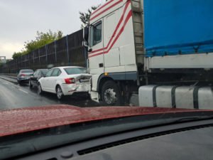 driver narrowly avoids a multivehicle truck crash