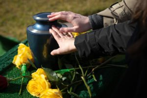 family members pay respects at funeral