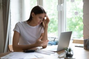 frustrated woman tries to file her taxes