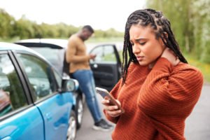 injured motorist deciding who to call after a collision