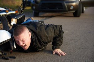 man thrown off his bike after a motorcycle crash