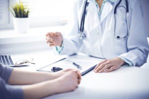 patient consults with doctor