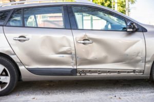 vehicle damaged after a sideswipe accident