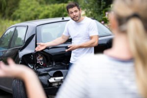 drivers argue after a car wreck