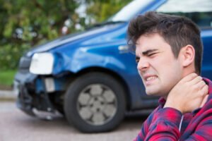 man feels neck pain after car wreck