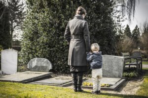 mother and child visit gravesite