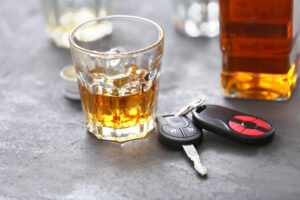 car keys with a shotglass