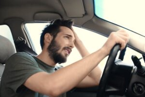 man-driving-from-an-accident-scene