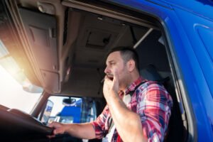 tired-truck-driver-on-the-road