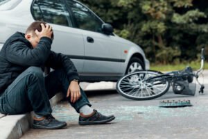 An accident on the way to Florida State Fair. A car has crashed into a bike.